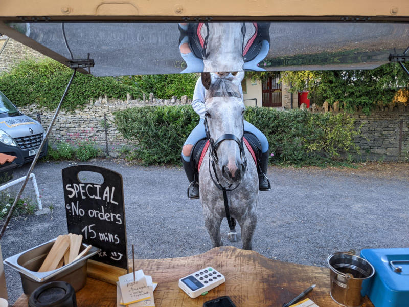 Photo of horse and rider waiting to be served